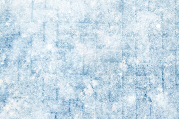 Winter texture of paving slabs covered with snow, top view, background surface in snow