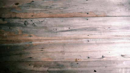 Wooden surface with natural texture and knots, rustic and warm atmosphere
