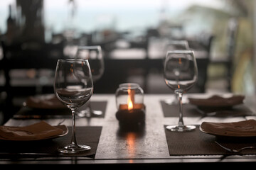 table setting in the restaurant, glasses and cutlery, a clean new table in the restaurant is waiting for guests, a free table