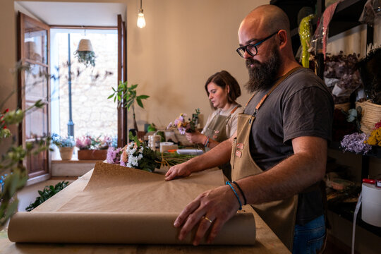 Florist entrepreneur working in a small business flower shop
