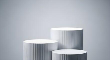 Modern silver cylindrical pedestals for product display on a soft purple gradient background