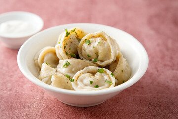 Russian dumplings served with sour cream