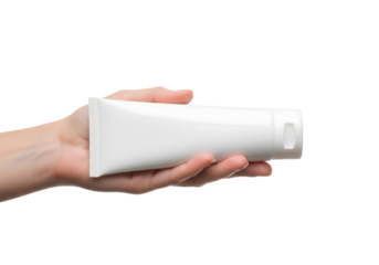 A hand is holding a white tube product, highlighting the concept of skincare and product placement. The image focuses on the human hand interacting with the object