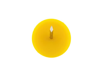 Isolated yellow circular disk with small vertical pin in center, studio shot, nobody here