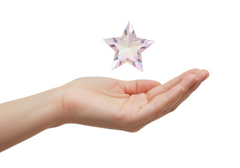 Isolated hand offering pink crystal star, palm up, conceptual gift, reward, prize, value