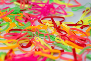 Fototapeta premium Colorful Chaos Vibrant Rubber Bands on White with Playful Abstraction.