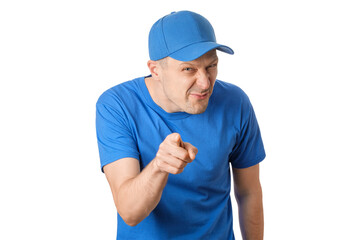 Man in blue shirt and cap points and looks confident with a playful expression in a bright setting