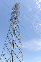 High voltage post. High-voltage tower on blue sky background.