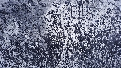 Abstract dark paint drips and splatters on light gray textured background grunge pattern