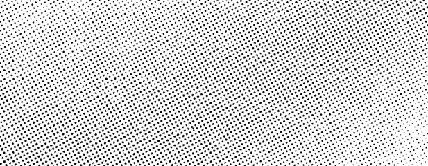 Distressed halftone dot pattern with irregular spacing and variation, isolated on a transparent background. © Vjom
