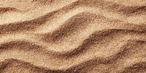 Rippled brown sand forms abstract patterns of light and shadow.