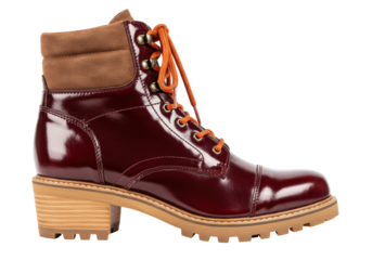 Isolated shiny oxblood-colored women's ankle boot with brown padded collar and lug sole platform