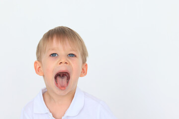 emotional portrait of a 4-6-year-old boy on a white background, cheerful and surprised child