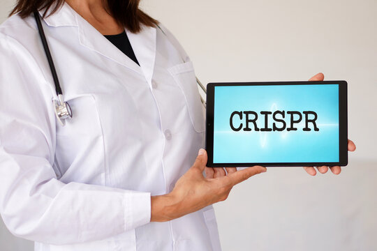 CRISPR concept. word written on a woman doctor's digital tablet.