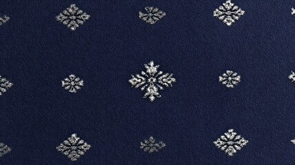 Textured navy blue fabric with repeating ornate silver floral patterns.