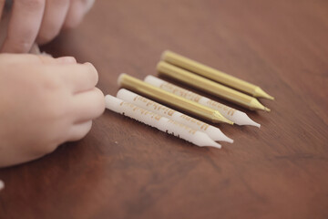 making candles for a birthday cake, unpacking