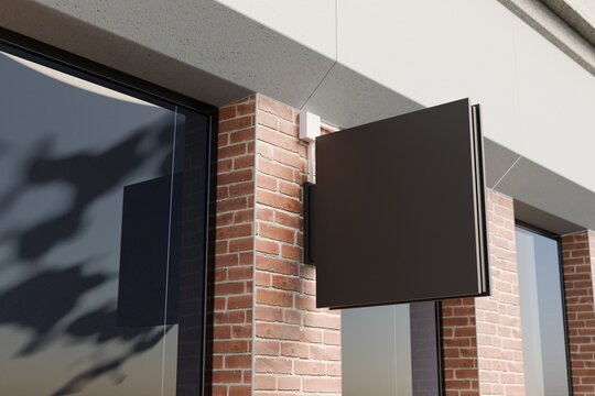 Blank square blade sign on brick facade, outdoor mockup