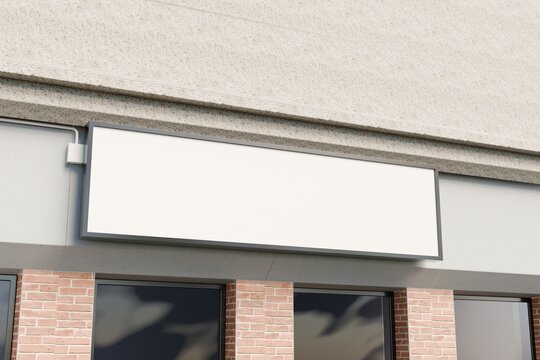 Wide lightbox storefront sign on stucco fascia, mockup