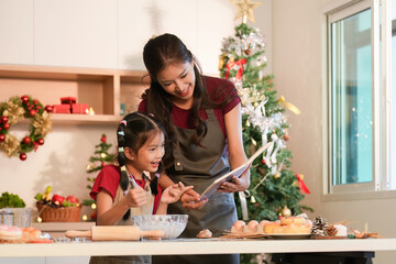 Festive Baking Mother and Daughter Creating Holiday Recipes Together