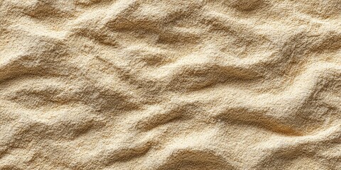 Close-up texture of fine, golden sand with gentle wave patterns.