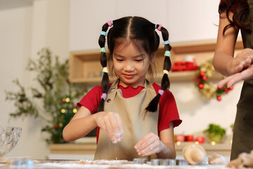 Baking Fun: Young Girl Sprinkling Flour with Joy