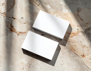 Business card mockup on textured surface with natural shadows, premium printing finish (matte or gloss), top-down photography style