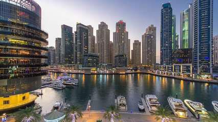 Dubai Marina towers and canal in Dubai day to night timelapse