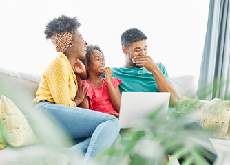 Mother, father and daughter doing homework with laptop at home. Mom, dad and teenage black girl happy using laptop. Teen girl and parents sitting at home working with notebook