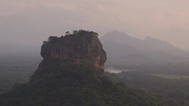 Breathtaking view of Mount Sigiriya from Pidurangala Rock at sunsets. The symbol of Sri Lanka Lion Rock is protected by UNESCO as a World Heritage Site. 120 fps ProRes 422 10 bit, C-LOG video.