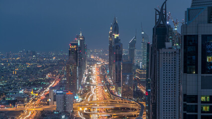 Naklejka premium Dubai Sheikh Zayed Road day to night timelapse near Dubai Downtown Closer Look shows the density of these roads