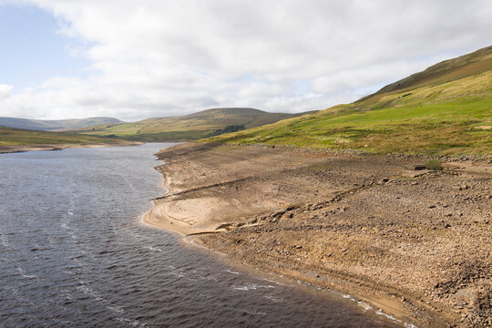 Scar House Reservoir with water at a low level in summer, UK