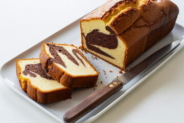 Delicious Marble Cake Slice on White Plate | Homemade Dessert with Chocolate and Vanilla Swirls Perfect for Bakery and Food Photography