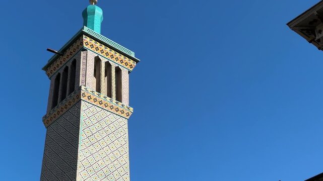Persian blue tile design of islamic minaret with traditional architecture Golestan Palace Qajar mansion historic landmark ancient fortress Middle East Tehran Iran culture tourism outdoors travel guide