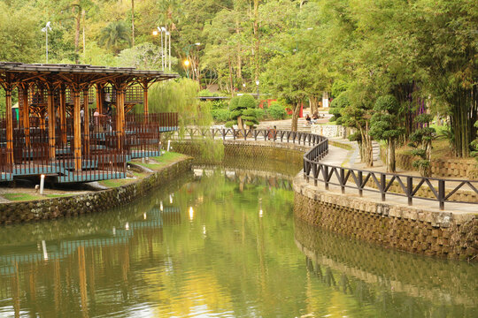 Leisure area by a decorative pond in a Kuala Lumpur park