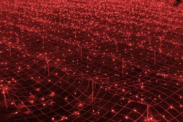 Gordijnen Bordeaux Abstract futuristic background of red LED lights arranged in grid pattern, network, glowing in dark night atmosphere. Bokeh textured backdrop shining on dark, festive holiday texture for design.  © katyamaximenko