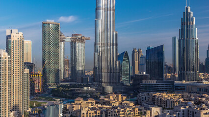 Naklejka premium Dubai Downtown skyline during sunrise timelapse with Burj Khalifa and other towers panoramic view from the top in Dubai