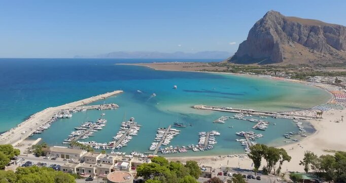 Aerial view of the marina of San Vito Lo Capo, a tourist resort in the province of Trapani, Sicily, Italy. In the background is Monte Monaco, a rocky massif, part of the Trapani Mountains.