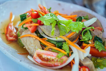 Delicious pork sausage salad in a Thai food menu