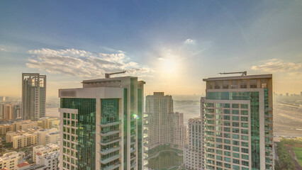 Obraz premium Sunrise over towers in Greens district aerial view from top timelapse.