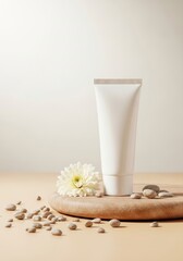 White cosmetic tube on wooden tray with flower and pebbles  
