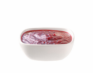 white ceramic bowl of raspberry jam  isolated on white background.