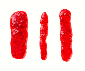 Splashes and stains raspberry jam isolated on white background, top view.  raspberry jam smear isolated, top view.