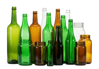 Isolated glass bottles and jars in multiple colors stand together to form a collection