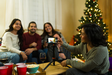 Friends taking group selfie at christmas holiday party
