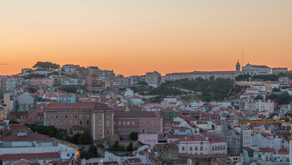Fototapeta premium Lisbon aerial cityscape skyline night to day timelapse from viewpoint of St. Peter of Alcantara, Portugal