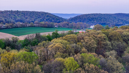 Obraz premium Aerial landscape of corn fields farmland mountains sunset rural Appalachia Central Pennsylvania