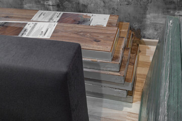 Laminate flooring panels stacked on floor ready for installation during home renovation