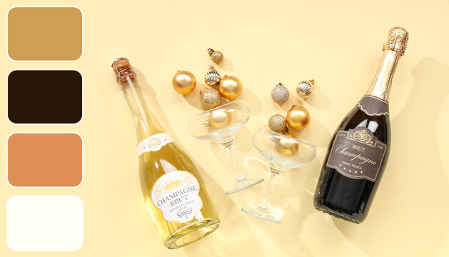 Bottles of champagne with glasses and Christmas balls on yellow background - Powered by Adobe