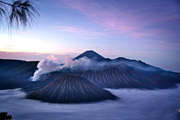 Mystical dawn over smoking Mount Bromo