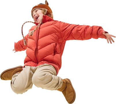 Excited boy in red jacket jumping mid-air with open arms and joyful face on transparent background. Concept of dynamic childhood movement, happiness, and stylish kids winter outerwear.